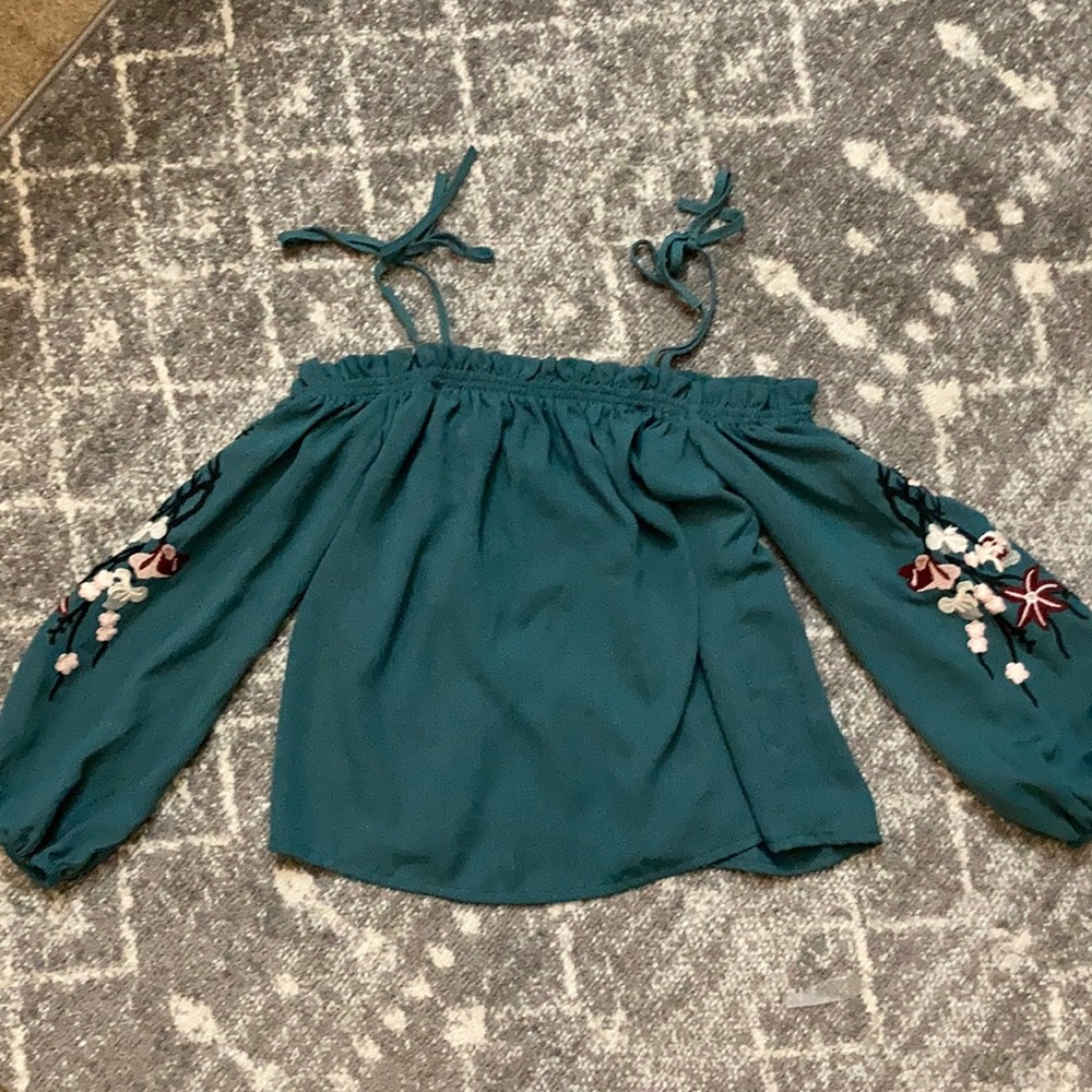 Blue blouse with tie straps and around shoulders!